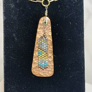 Copper hand beaded pendant necklace on gold tone paper clip chain
